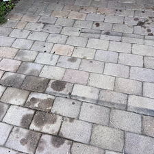 Pressure-Washing-Driveway-Oil-Stain-and-paint-removal-from-paver-driveway-located-at-Greenacres-FL-33415 3